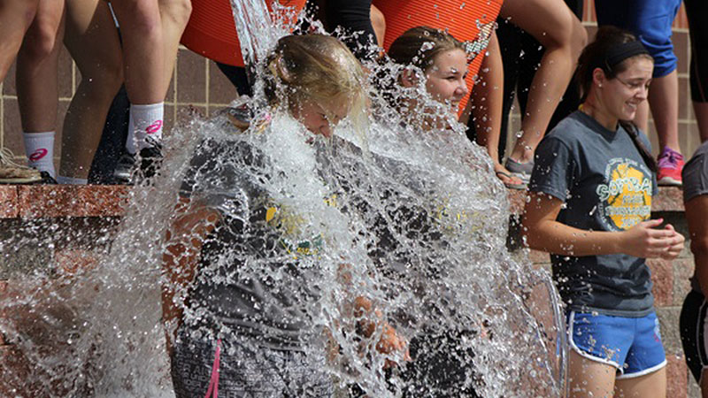 Girls getting doused with ice water