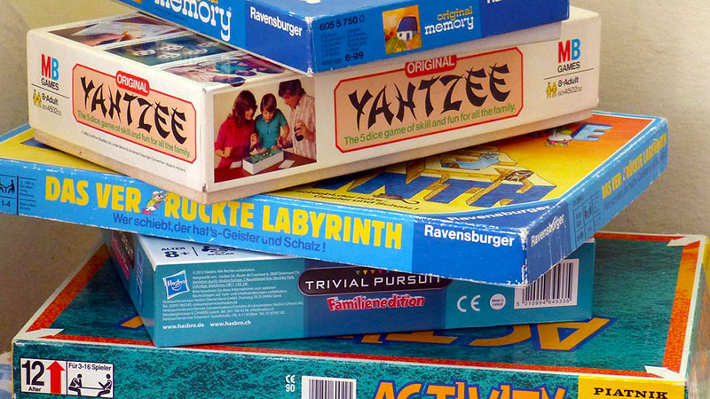 Board Game Boxes stacked on top of each other