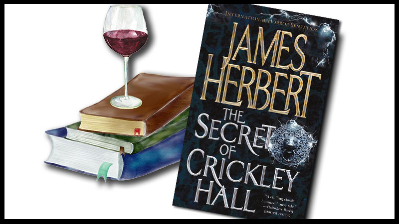 The Secret of Crickley Hall by James Herbert book cover with a glass of red wine setting on top of a stack of books.