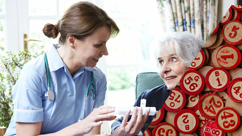 Nurse Advising Senior Woman On Medication At Home split screen with BINGO discs.