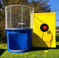 Photo of a dunk tank with a blue base and a yellow panel surrounding the target.
