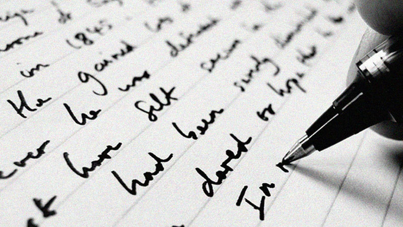 Black cursive writing on lined notebok paper.
